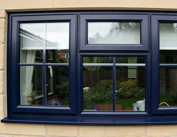 Home exterior featuring a white-framed window with curtains and indoor plants, surrounded by climbing vines on a textured wall, showcasing classic style, improved insulation, and professional Window Replacement Alpharetta services.